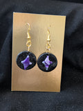 purple silver and white star on black circle