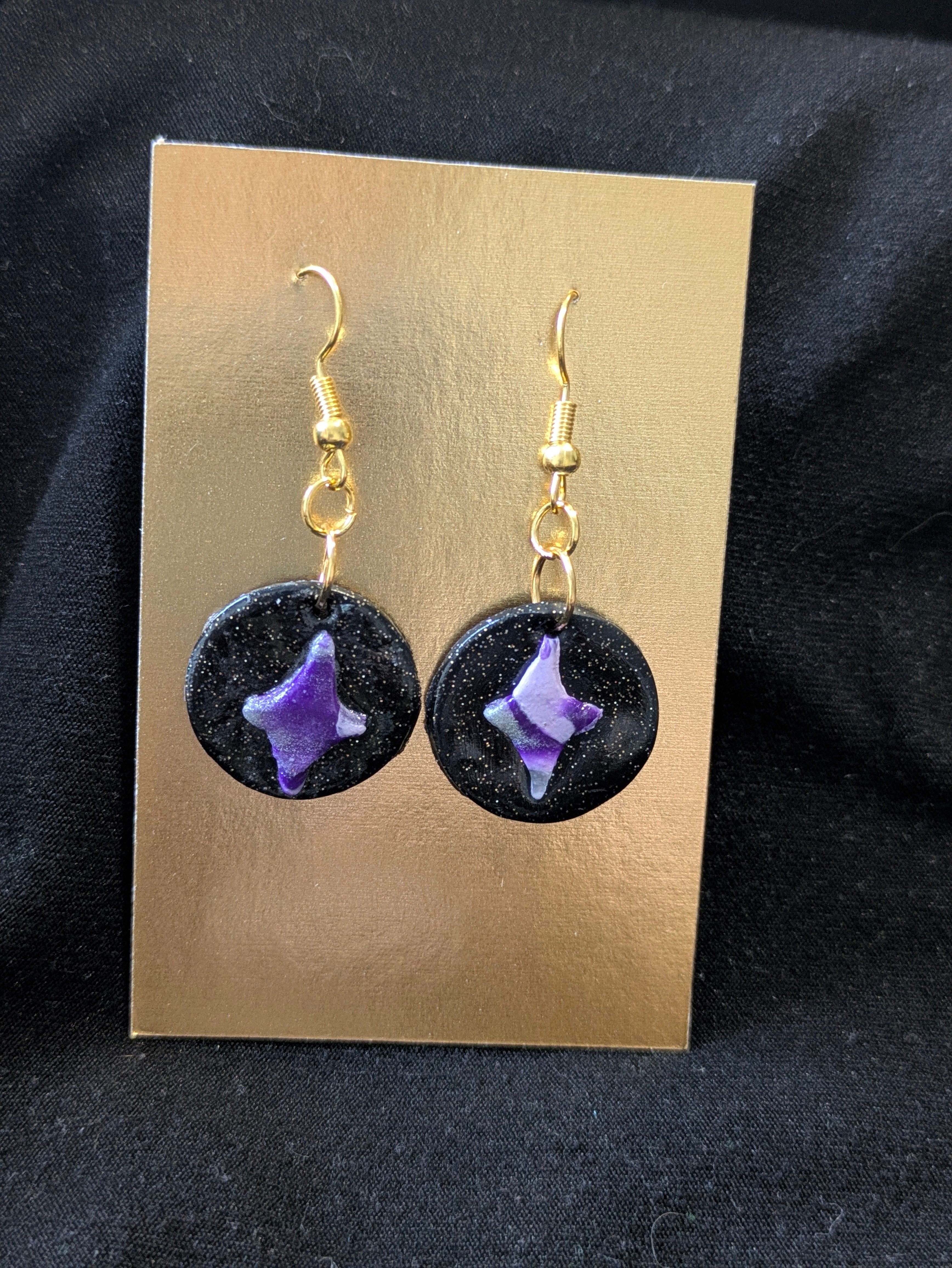 purple silver and white star on black circle