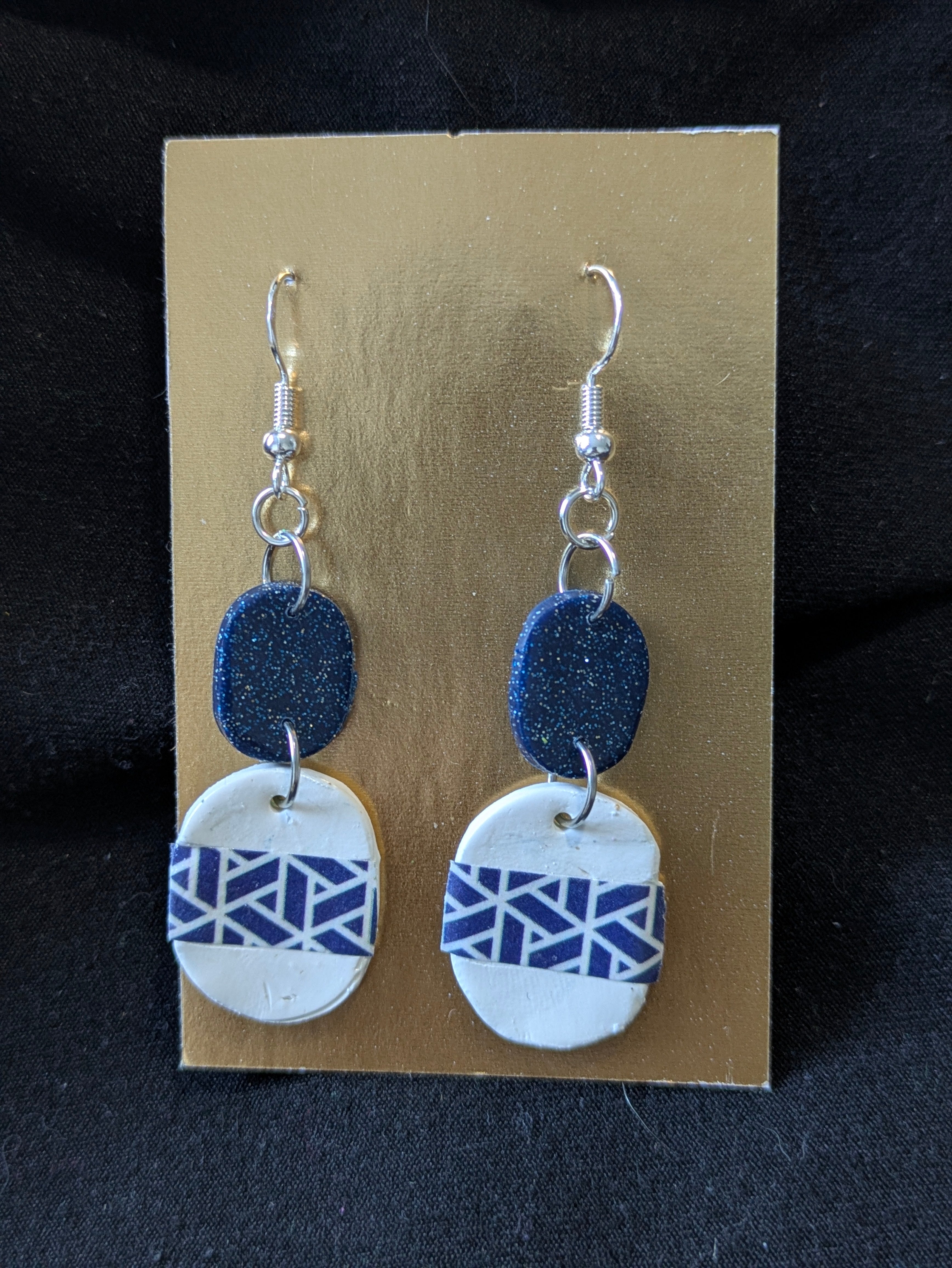 white oval and blue with blue and sparkle oval