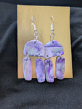 Purples, silver and translucent half circles and dangling rectangles