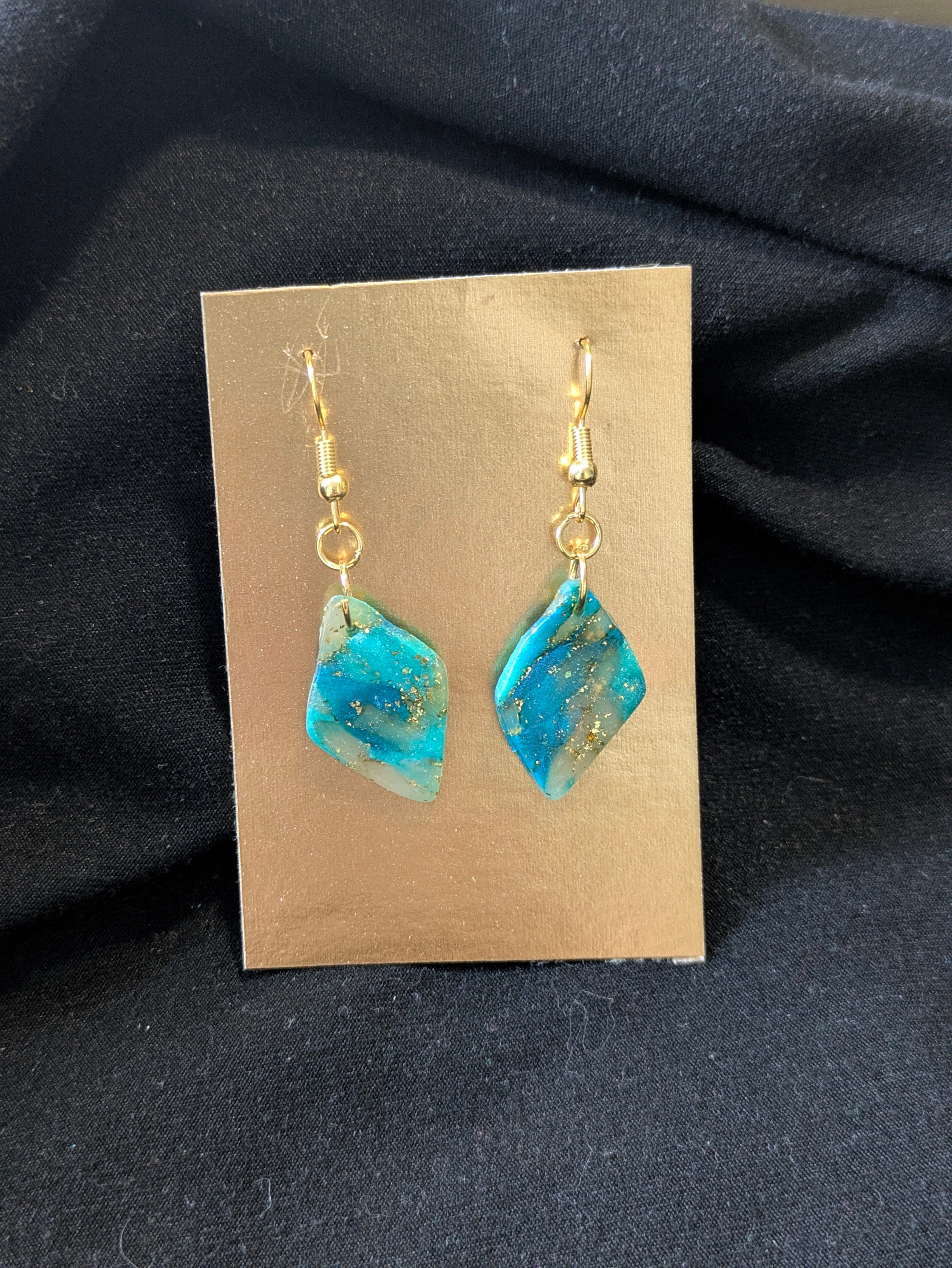 Blues, gold leafing and translucent diamonds