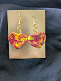 Red orange and yellow heart with cunt on it