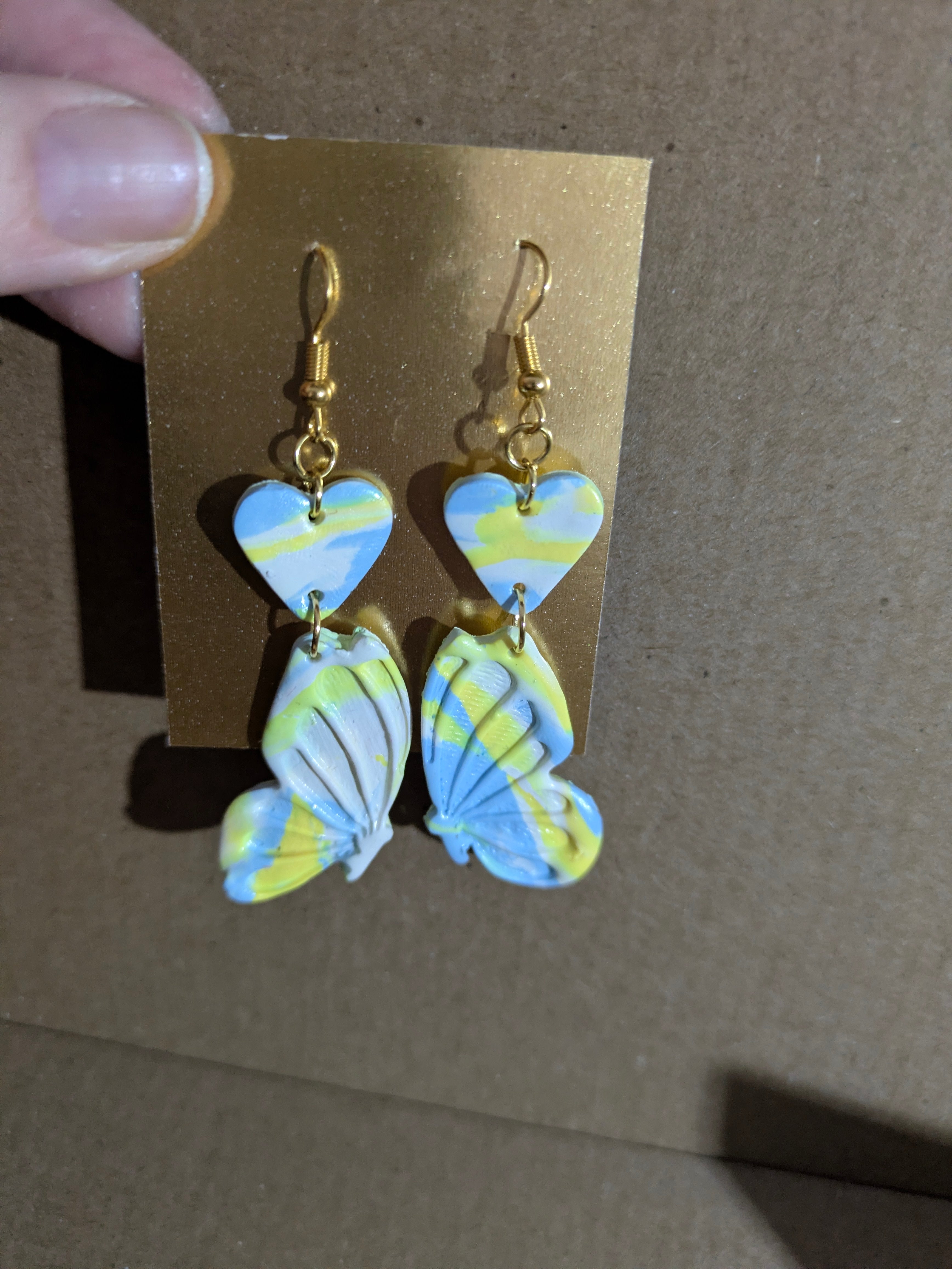 Blue and yellow butterflies with hearts