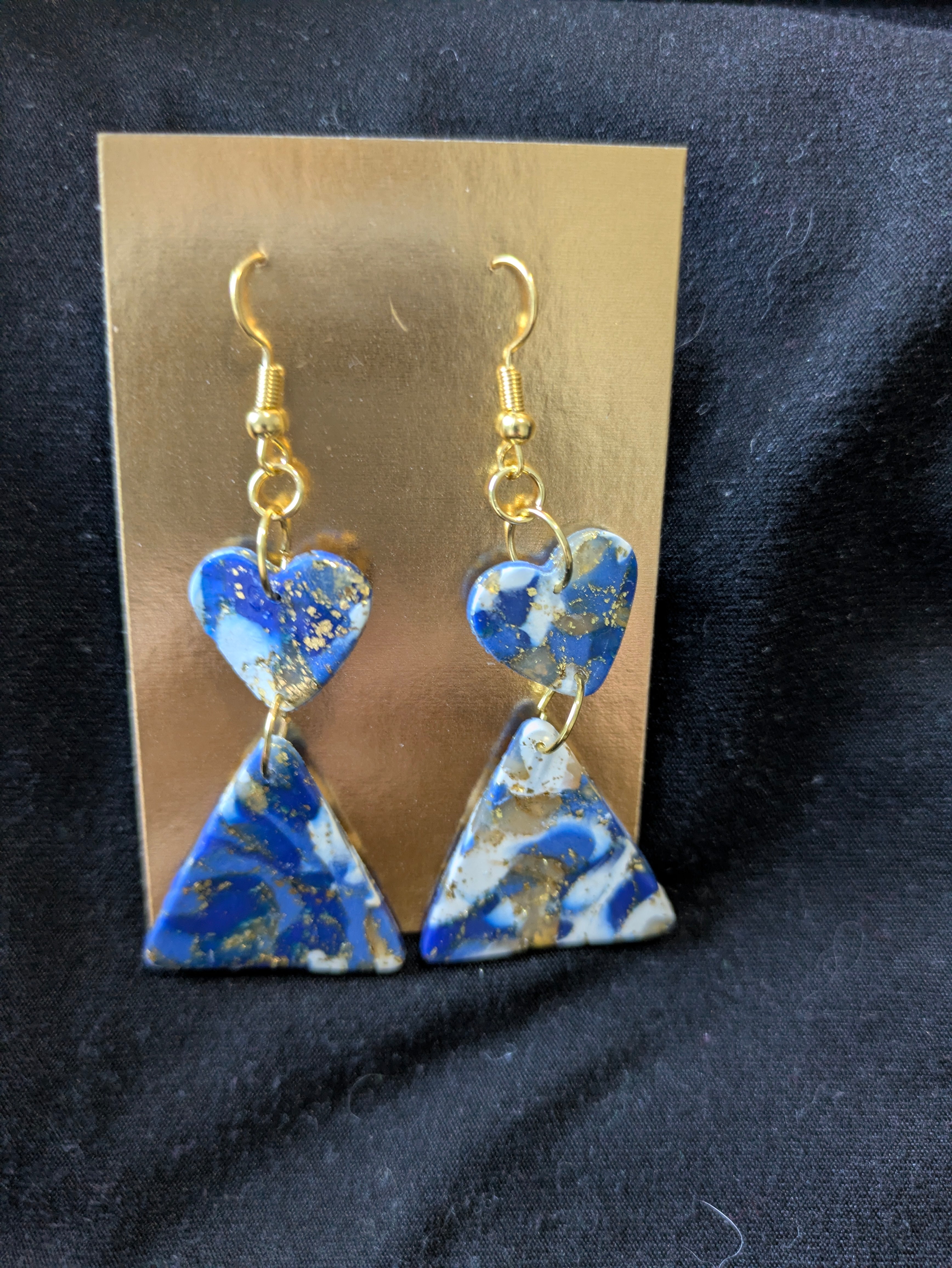 Blues and white with translucent and gold leafing hearts and triangles